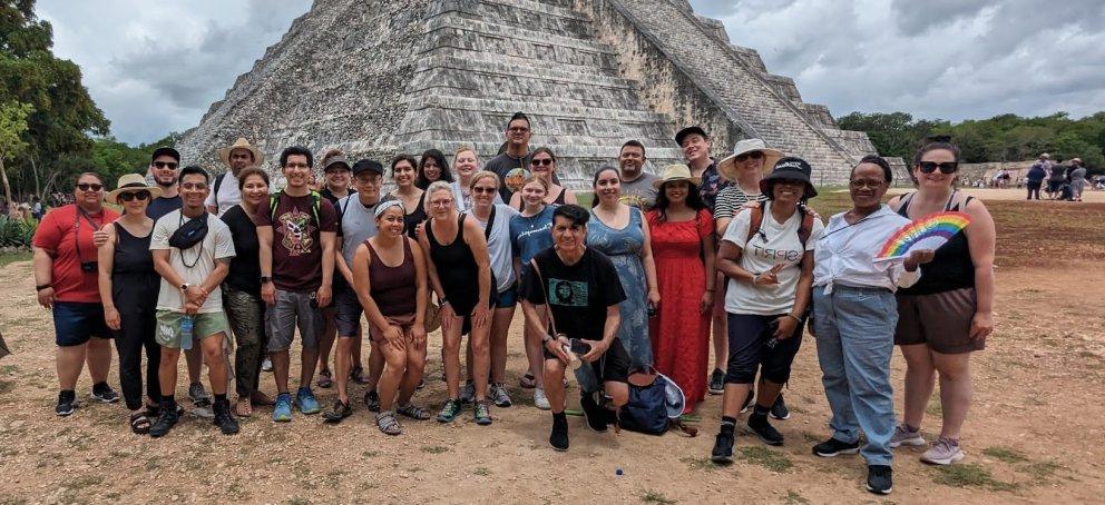 A group in front of an ancient Mexican pyramid